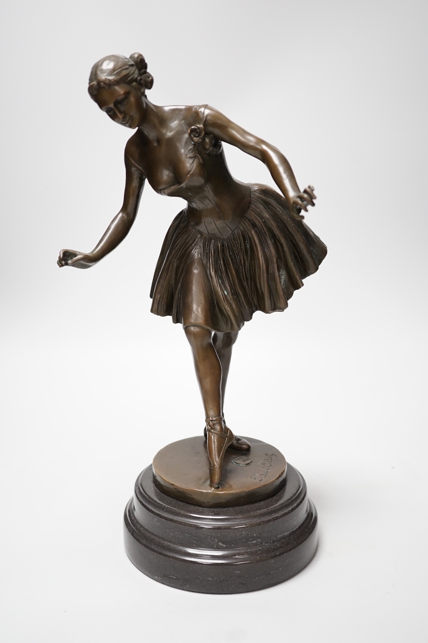 A bronze figure of a ballerina, signed, 40cm tall